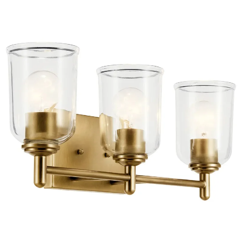 Industrial Lighting for Printing Press FacilitiesShailene 21" 3-Light Bathroom Vanity Light with Clear Glass, Natural Brass Finish Industrial Lighting for Printing Press FacilitiesShailene 21" 3-Light Bathroom Vanity Light with Clear Glass, Natural Brass Finish